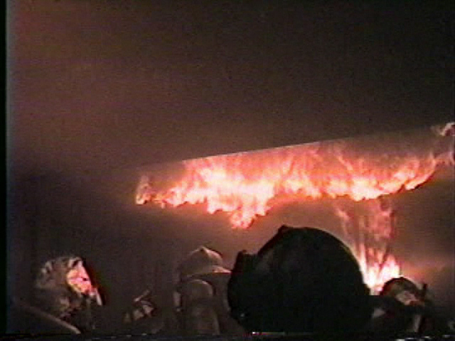 Firemen fighting an indoor fire