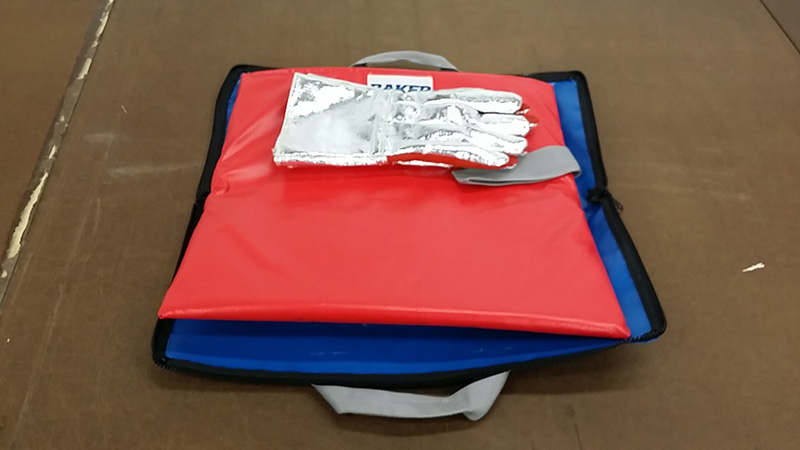 red and blue HOT-STOP L fire containment bags with a pair of silver gloves on top